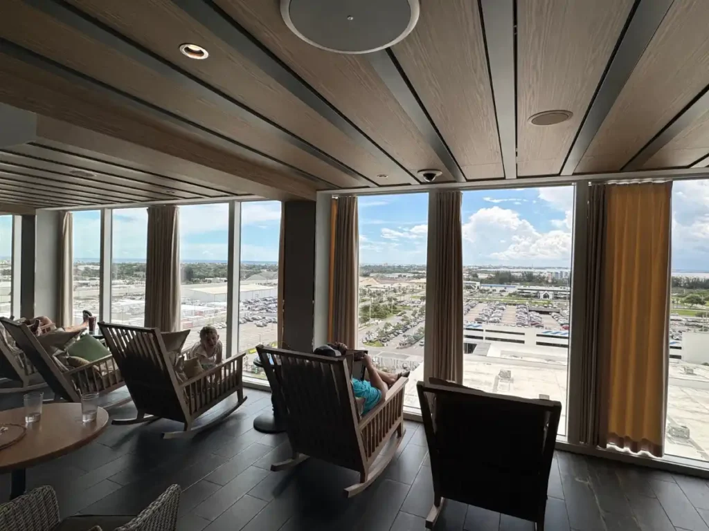 Large floor to ceiling windows in the Mason Jar Bar on Utopia of the Seas