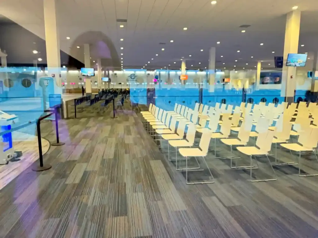 An empty seating area inside the Port Canaveral cruise terminal early in the morning during a back-to-back turnaround day.